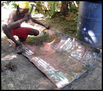 preparing recycled metal steel drum in Haiti - Haitian metal tropical designs . - www.tropicdecor.com